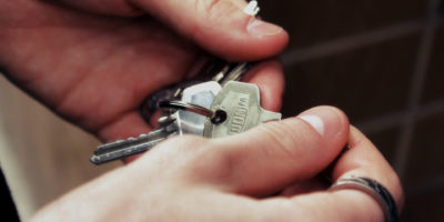 Hands holding a set of keys