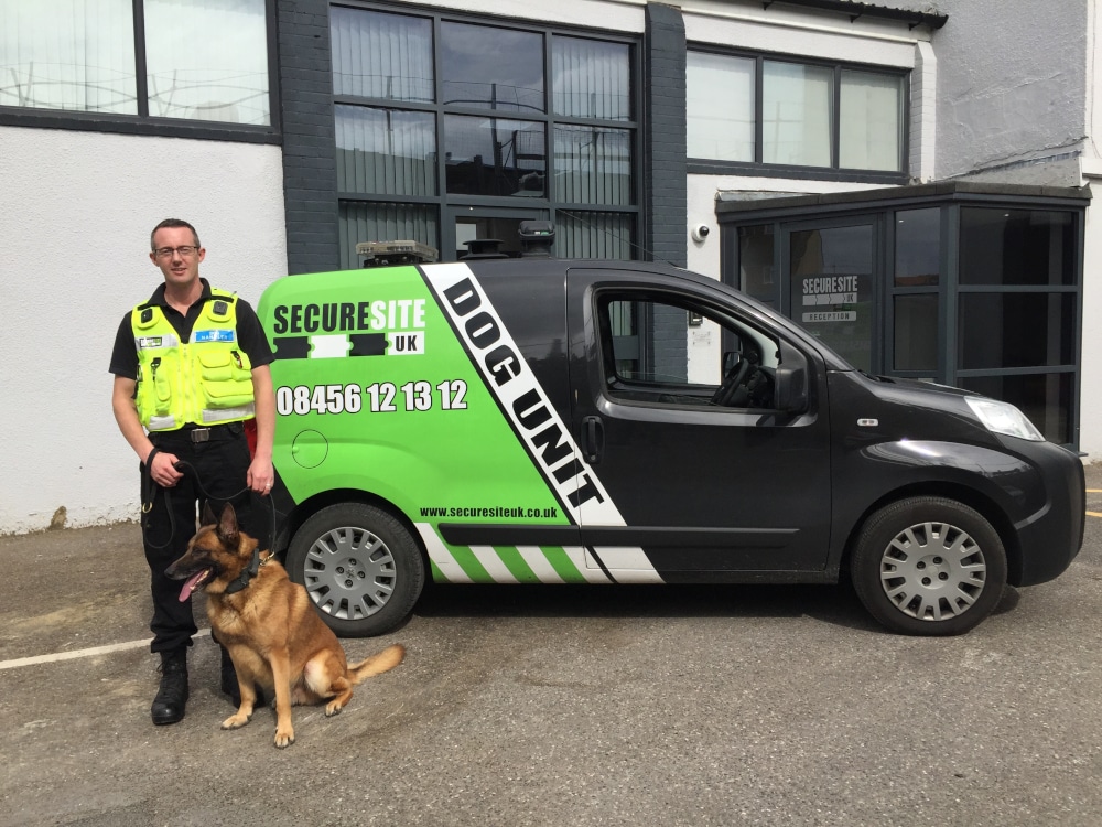security-dog-and-handler-with-a-branded-van
