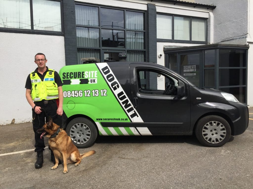 Security Dog Handler with their dog and van.