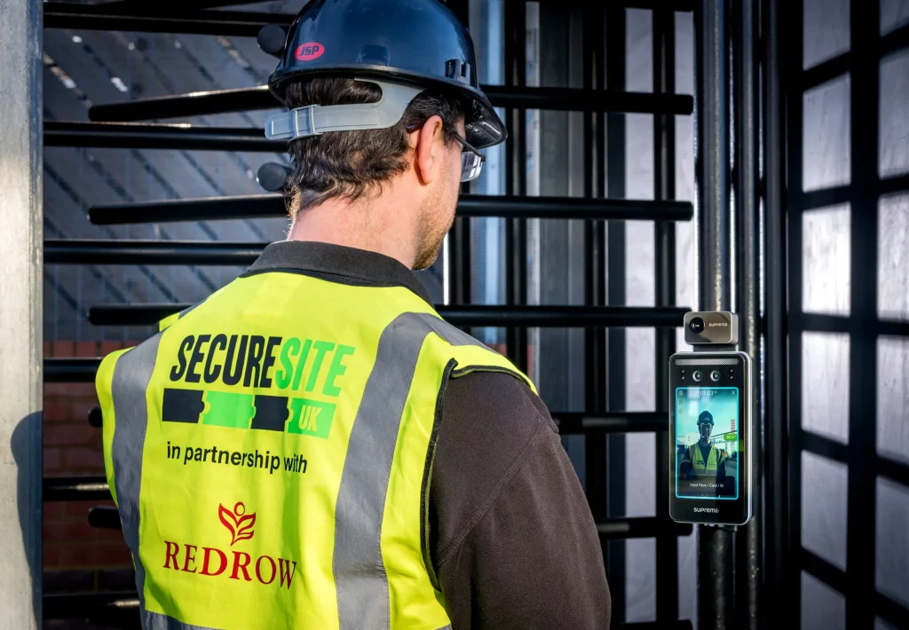 Construction site access control turnstile with face recognition scanner and temperature-checking thermal camera